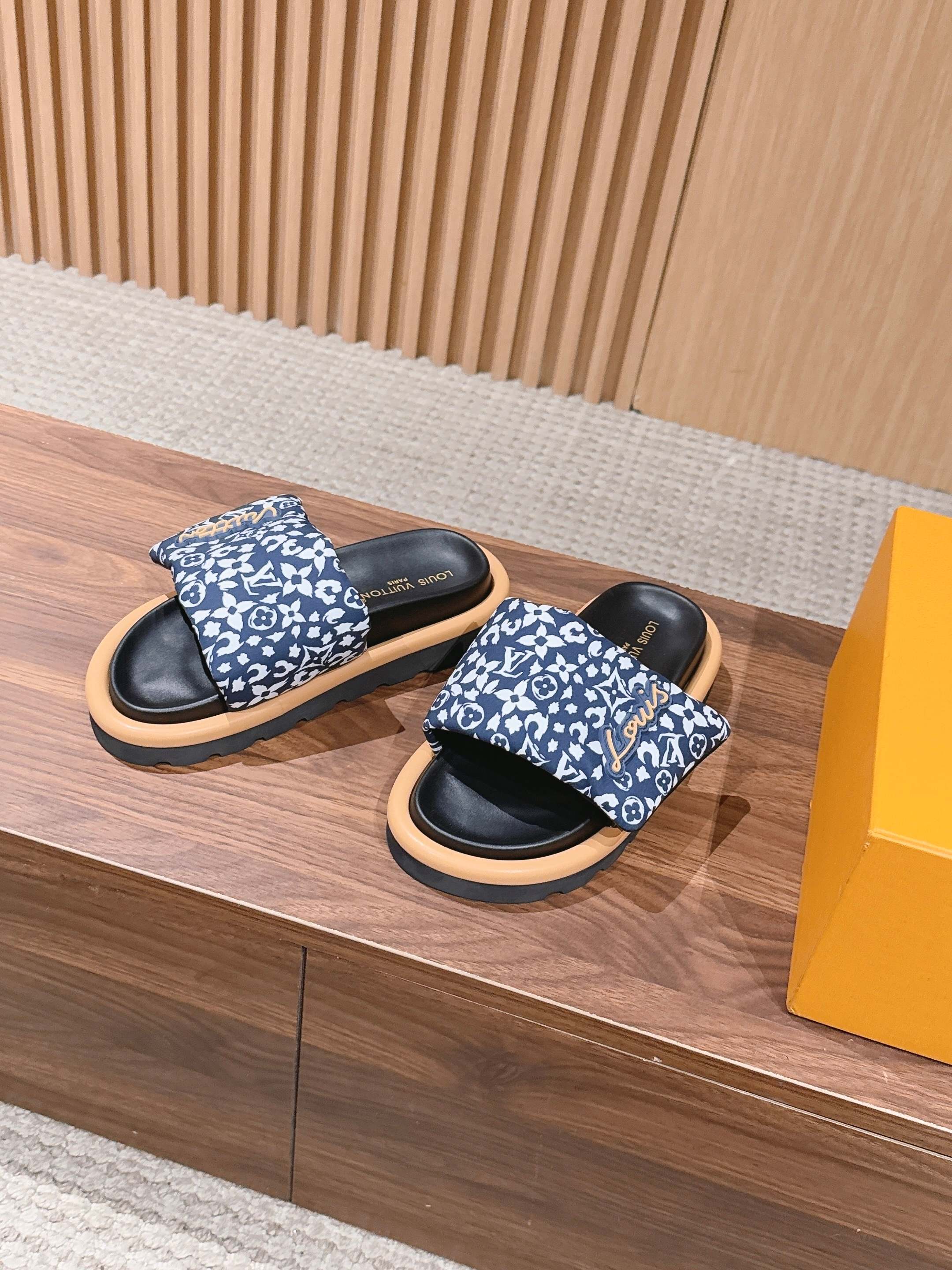 Louis Vuitton slide sandals, blue monogram floral straps, black footbeds, light soles