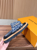 Louis Vuitton slide sandals, blue patterned strap and black footbed with tan sole