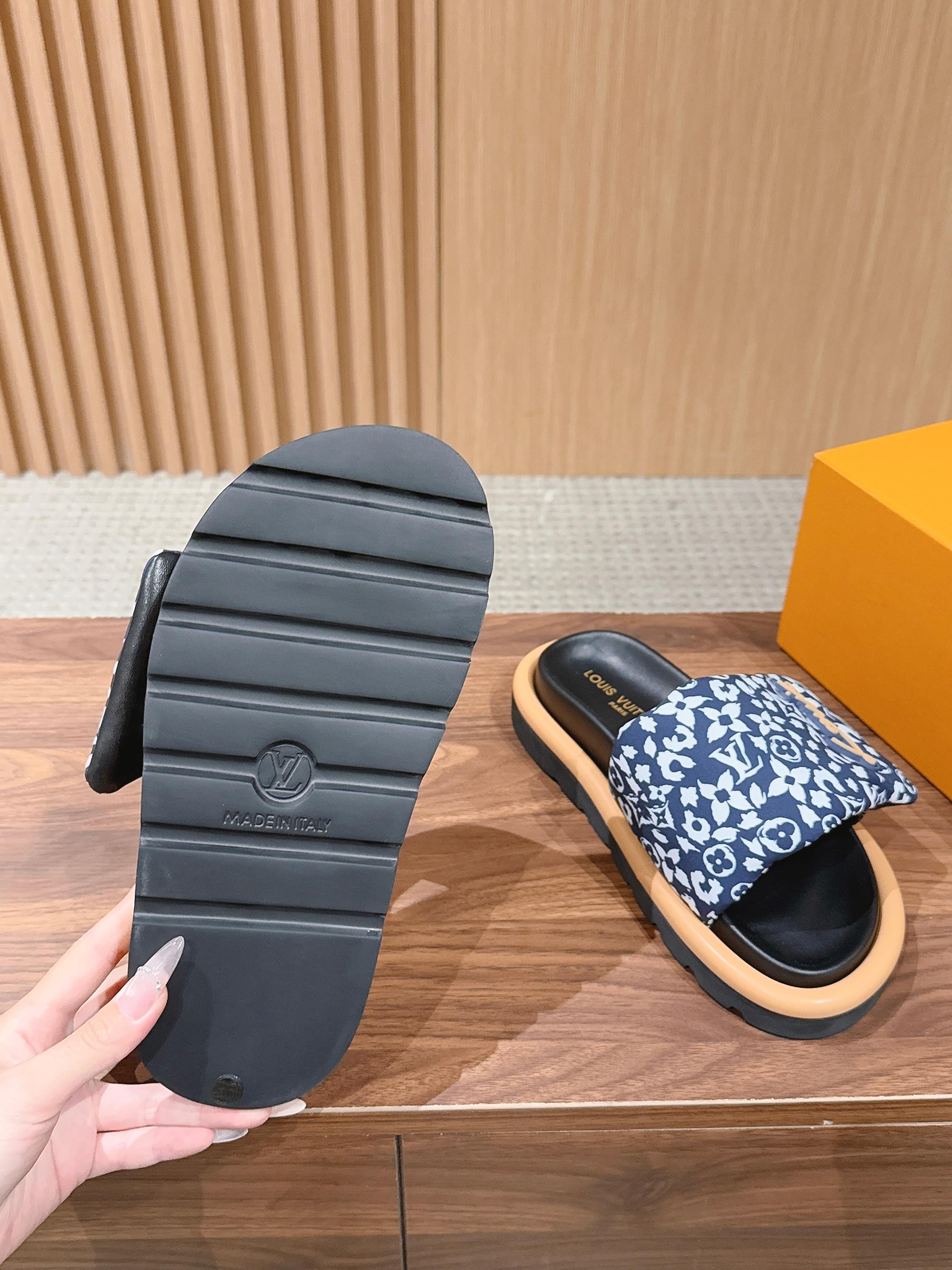 Louis Vuitton slide sandal outsole view with tread, plus blue patterned strap and tan sole