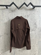 Brown jacket with stand collar and front zip; angled view showing shoulders and cuffs