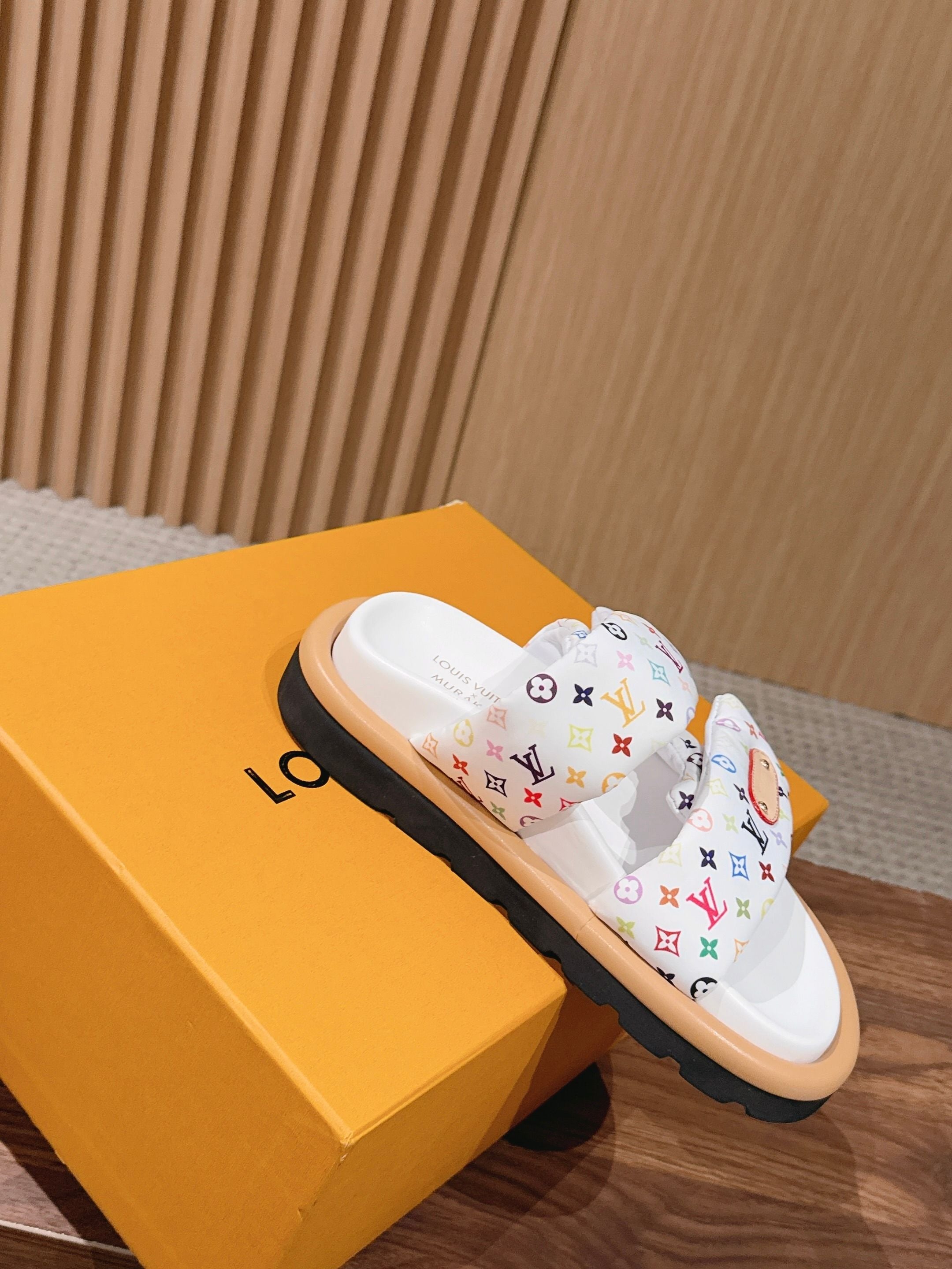 Louis Vuitton logo sandals with white multicolor monogram straps and black platform sole