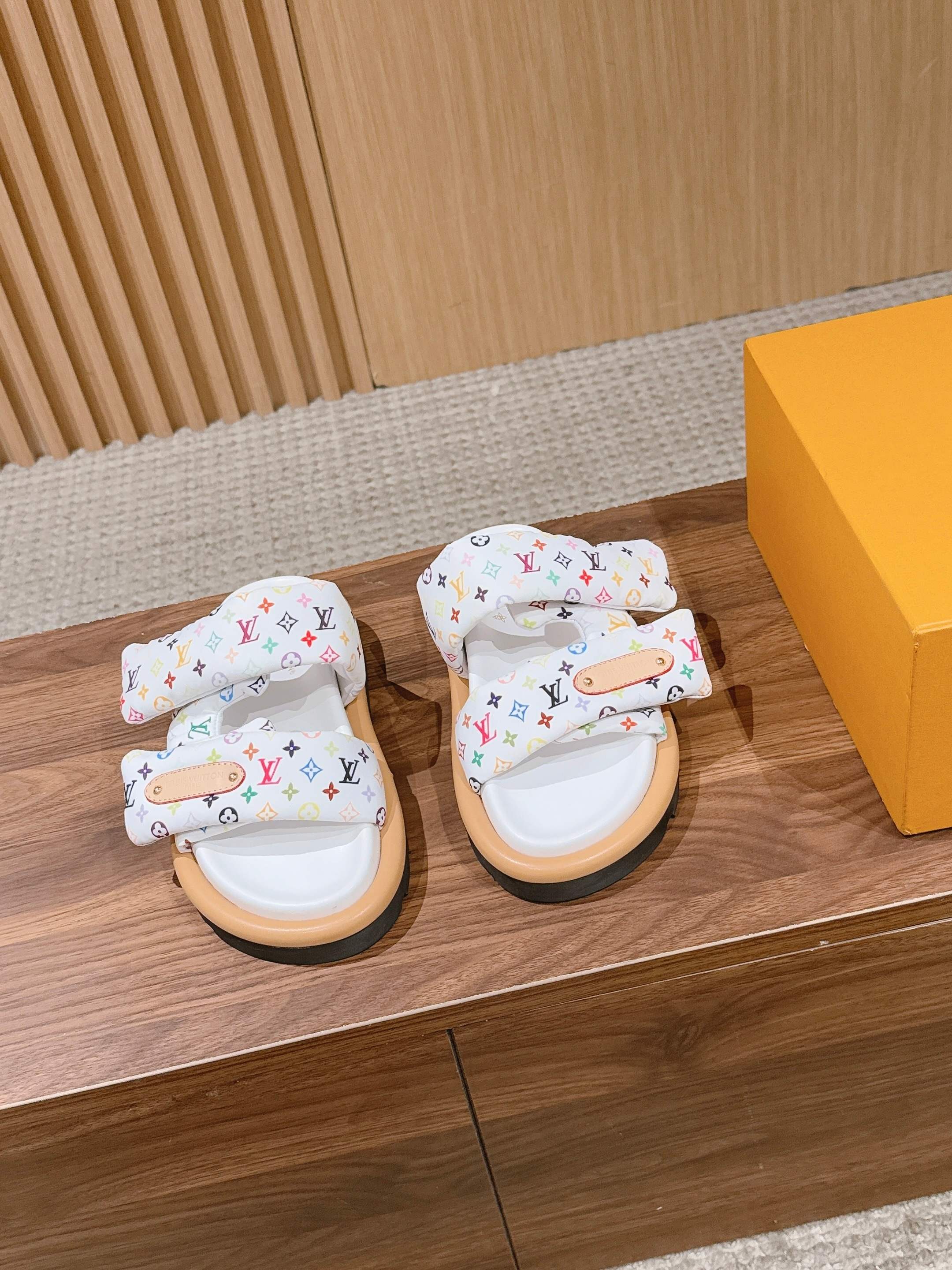 Louis Vuitton logo slide sandals with white multicolor monogram straps and black rubber sole