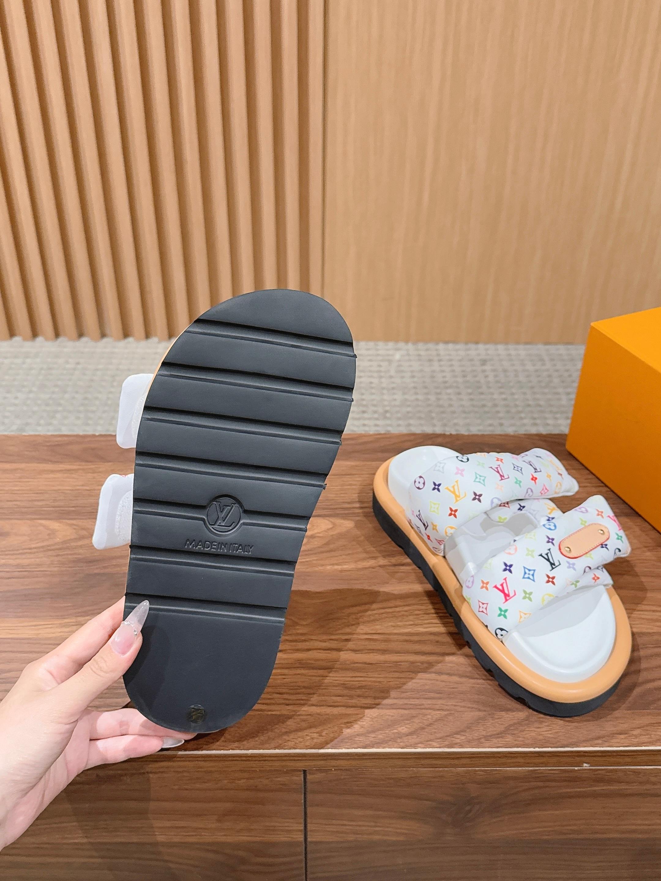 Louis Vuitton sandal outsole view, dark ridged rubber sole with white monogram upper