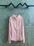 Light pink zip-up jacket with stand collar and chest pocket
