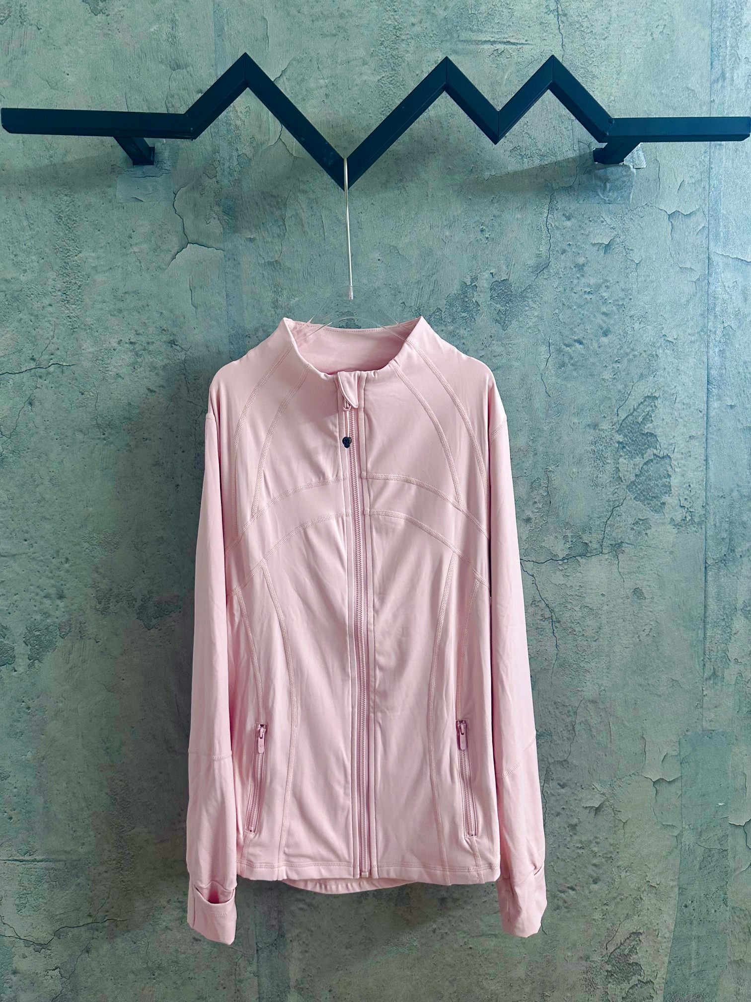 Light pink zip-up jacket with stand collar and chest pocket