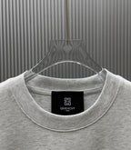 Light gray Givenchy crewneck T-shirt neckline close-up with inner tag