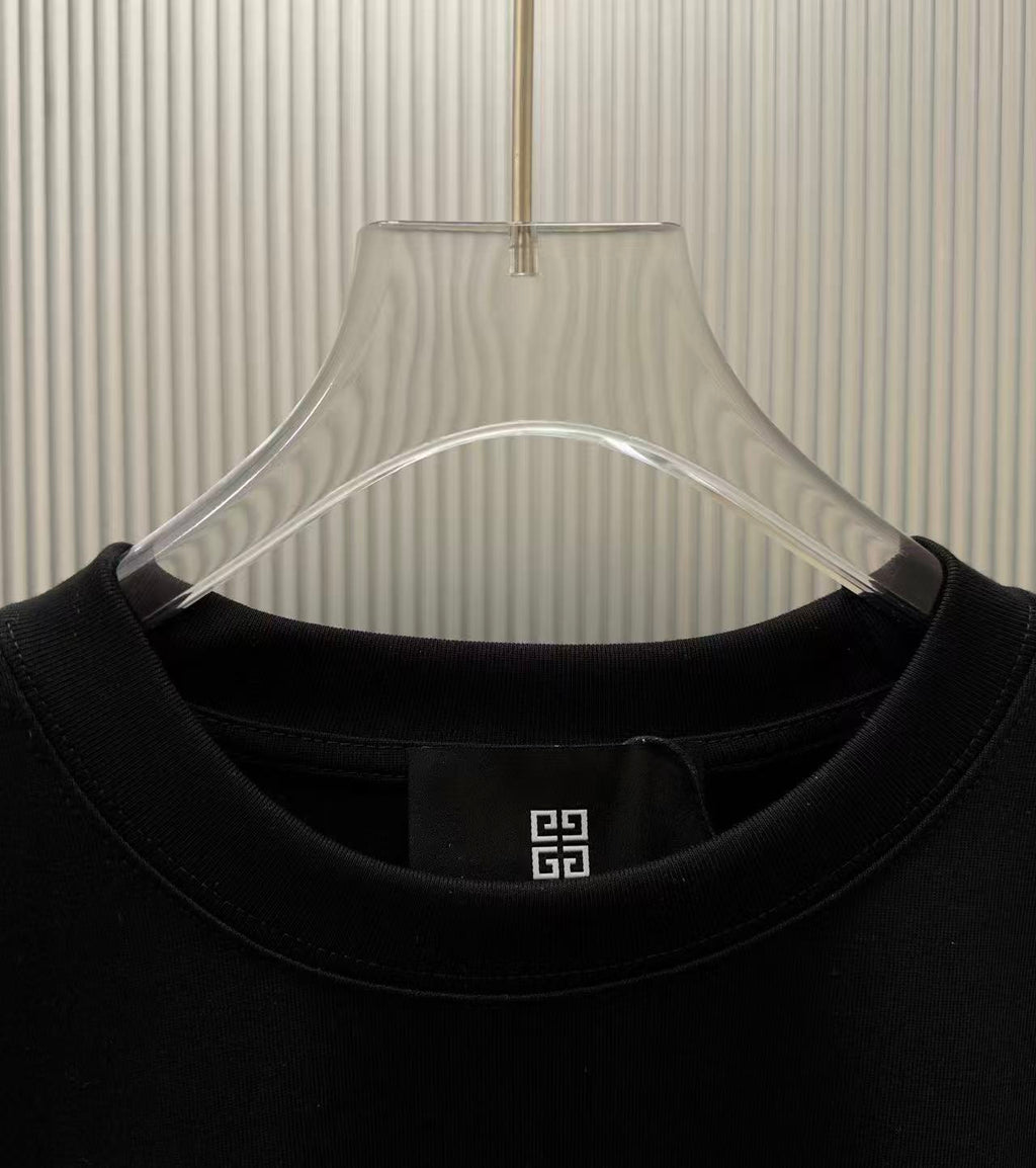 Black crew-neck T-shirt neckline detail with small logo label