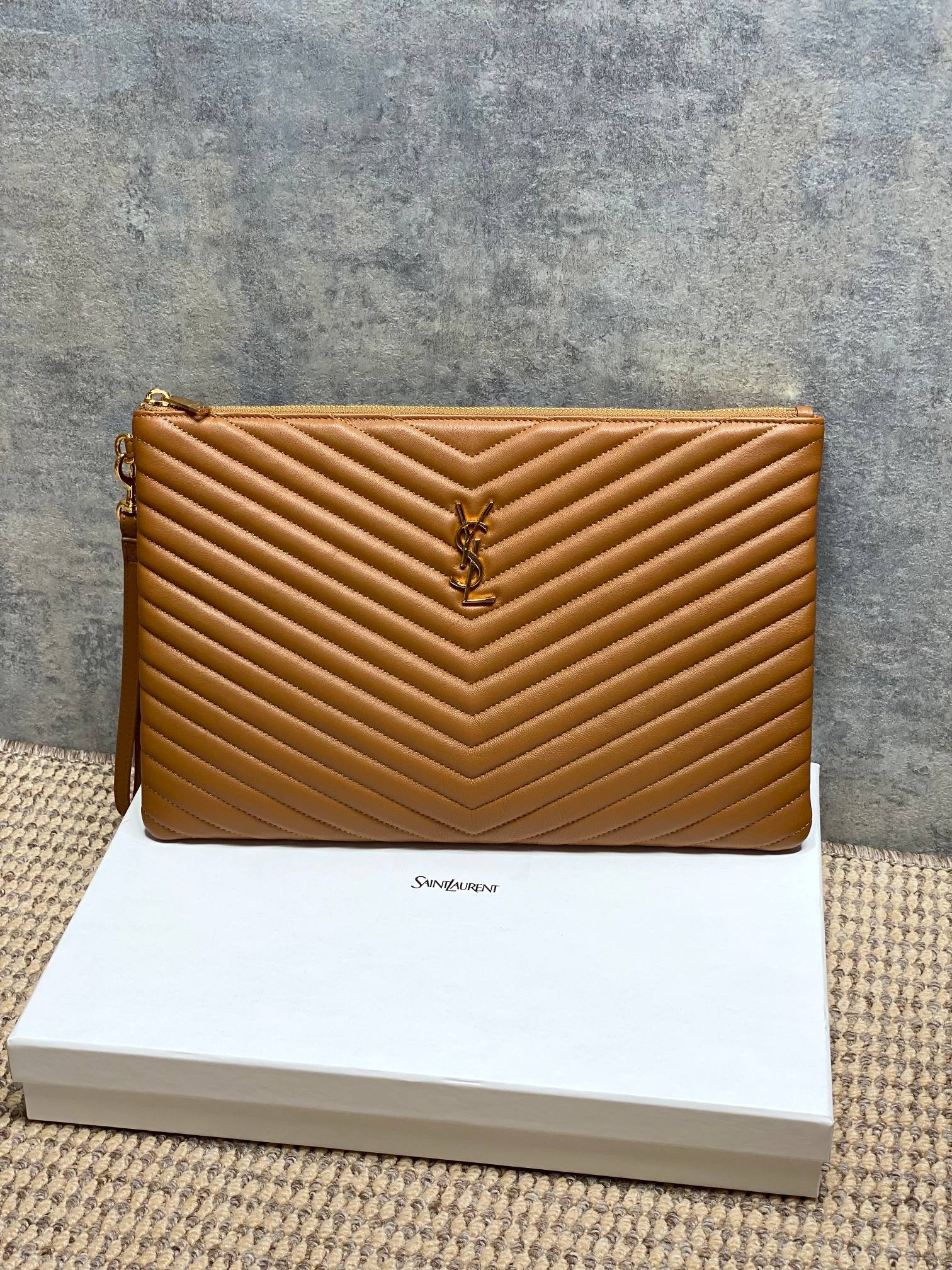 Tan quilted leather small clutch bag with YSL logo and gold-tone top zip