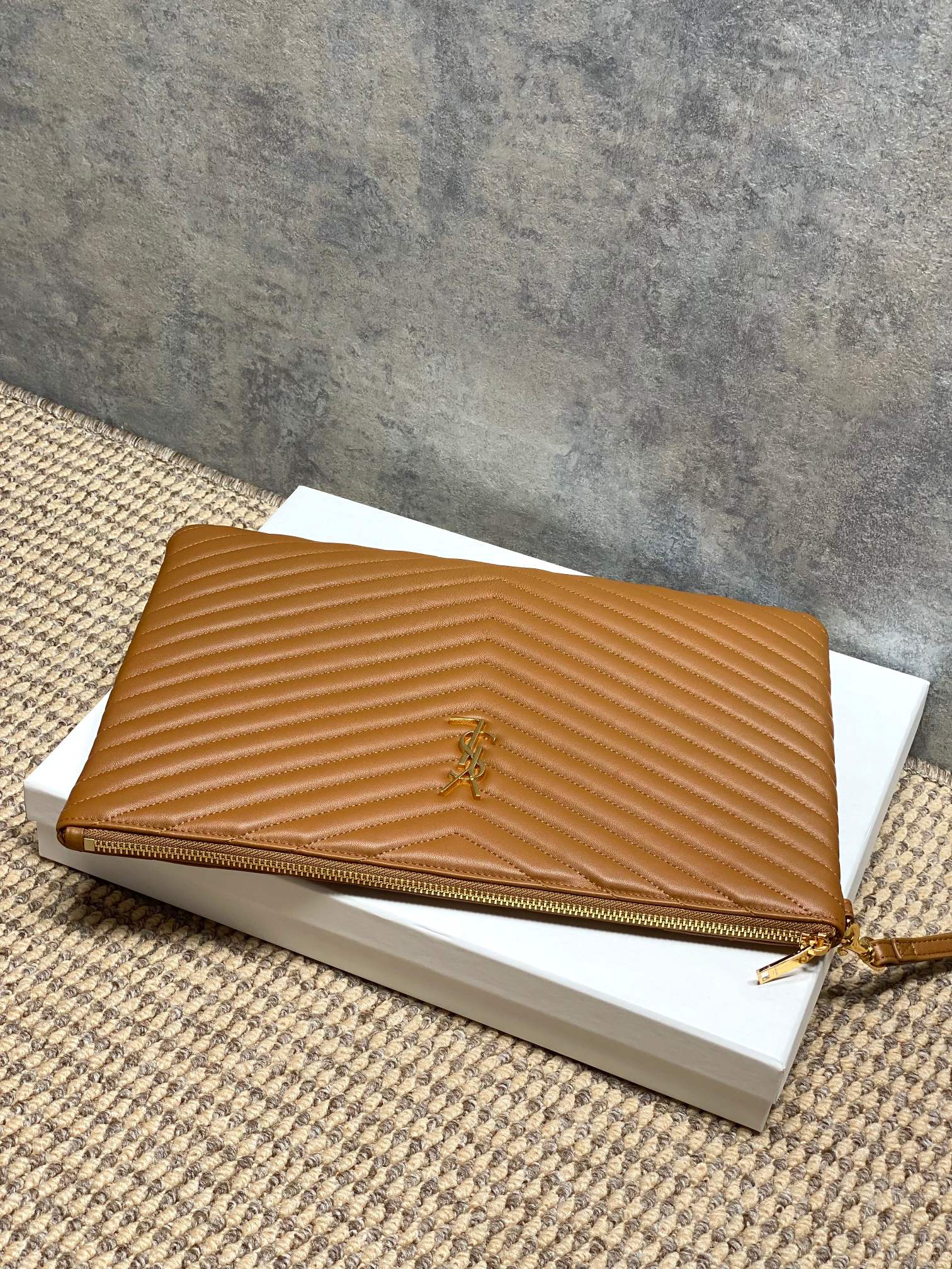 Tan quilted YSL bag with gold chain strap and side zip opening