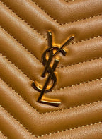 YSL gold-tone logo emblem on tan quilted leather panel