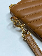 Tan leather strap with gold-tone clasp hardware
