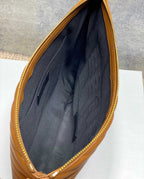 Black YSL bag interior with quilted panel and zip opening
