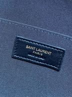 SAINT LAURENT PARIS leather label on dark fabric interior lining