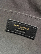 SAINT LAURENT Paris fabric label on dark interior lining