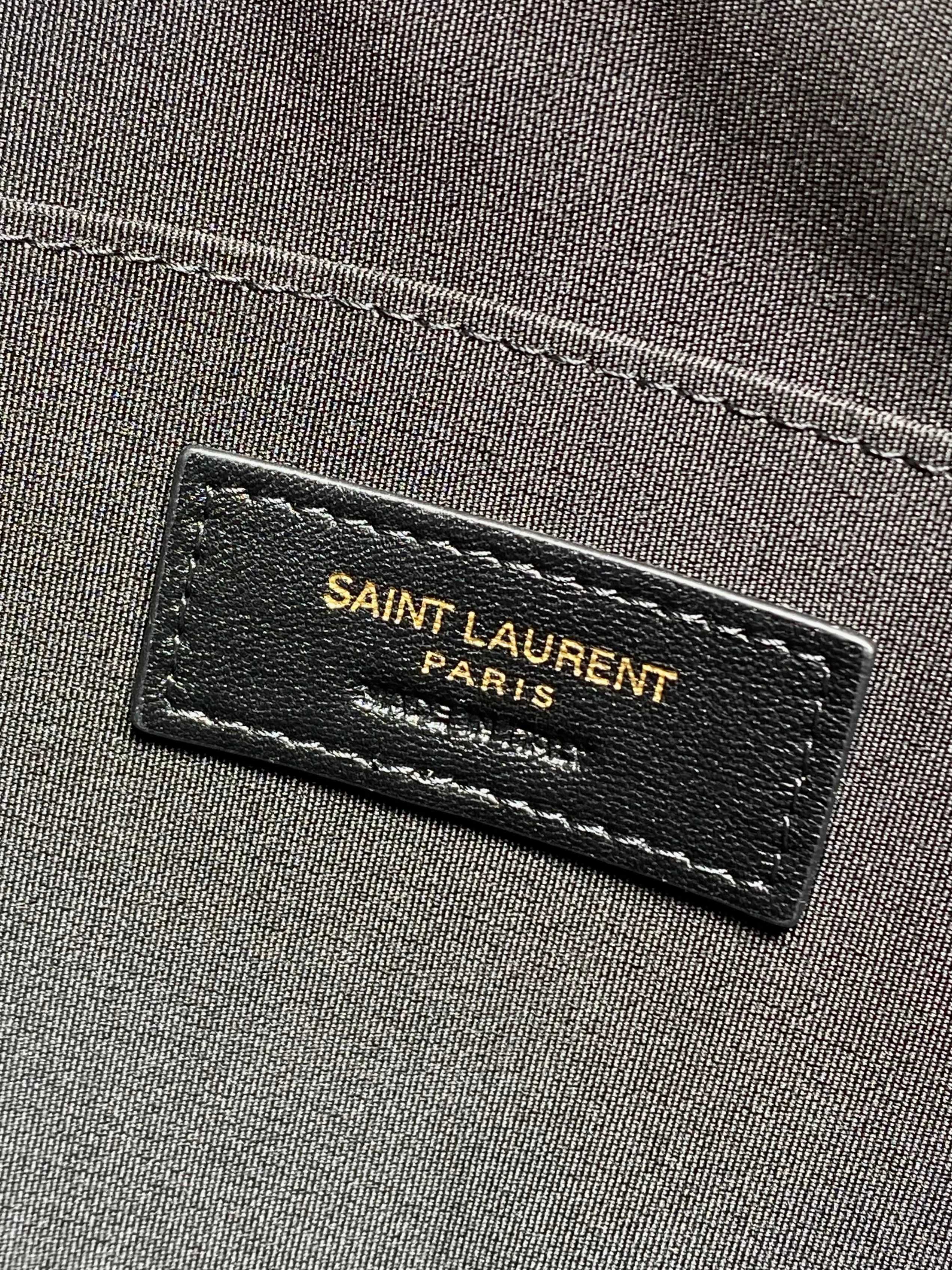 SAINT LAURENT Paris fabric label on dark interior lining