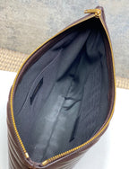 Small YSL bag interior with dark lining and gold zipper edge