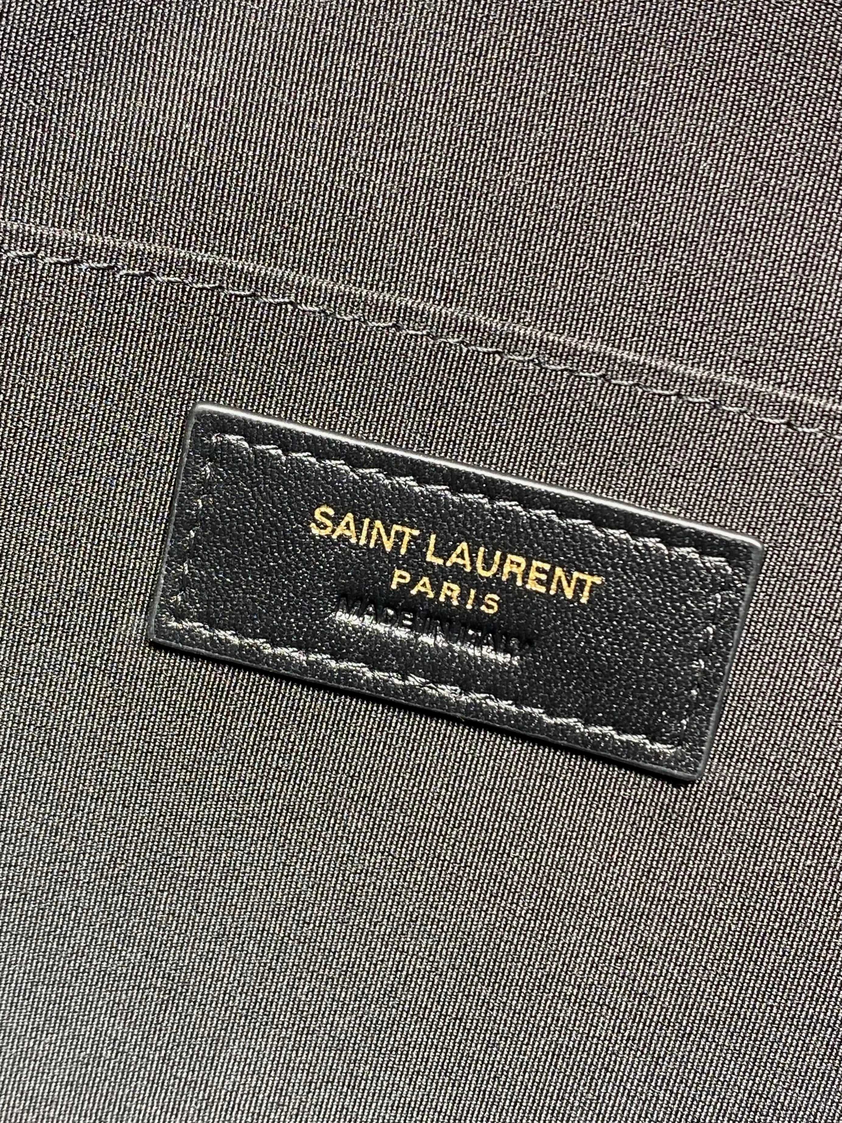 YSL clutch interior brand label with Saint Laurent Paris text