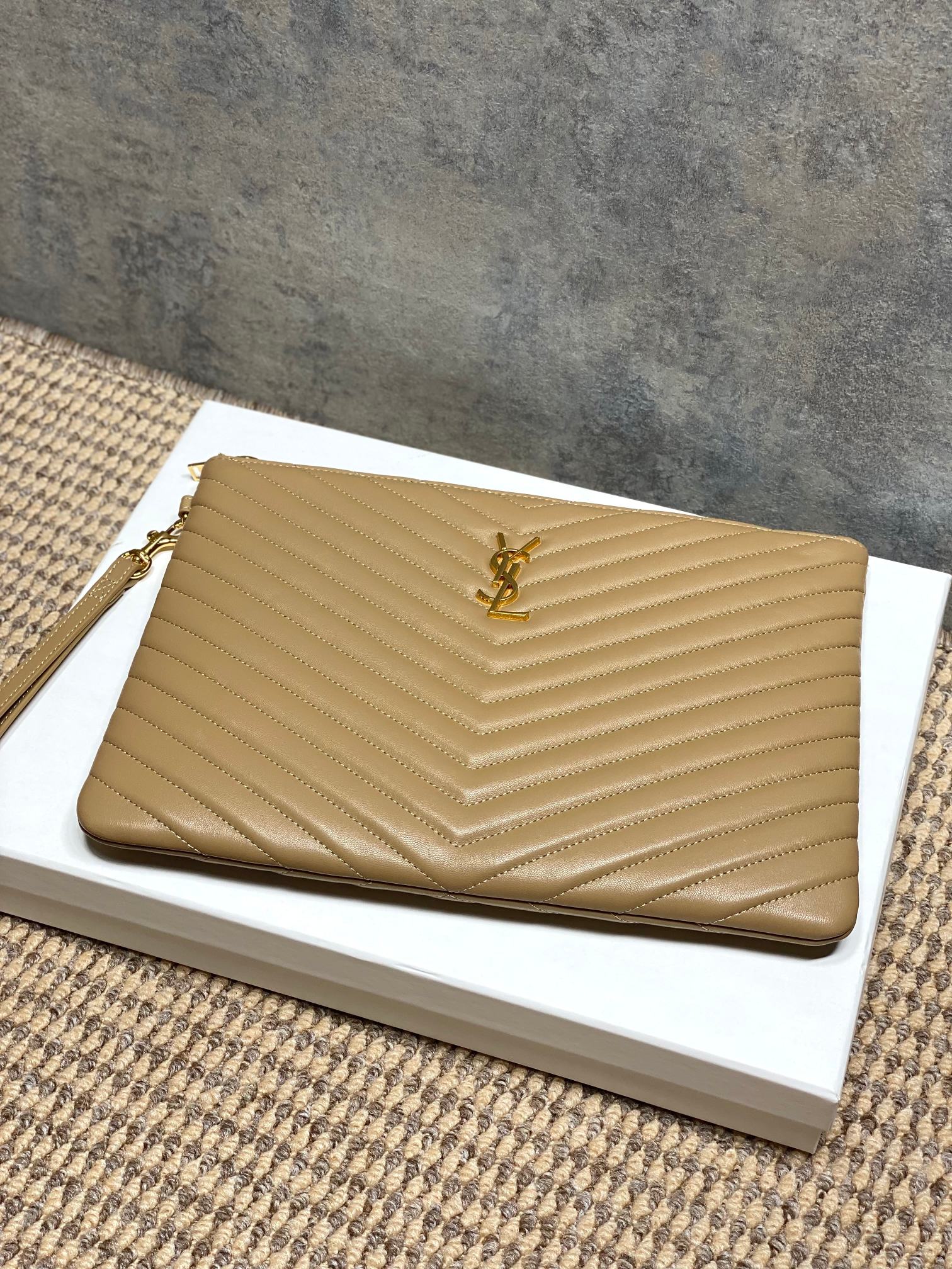 YSL bag with chevron stitched tan exterior and front YSL logo, front view