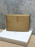 Quilted small shoulder bag with chevron pattern and gold YSL logo clasp