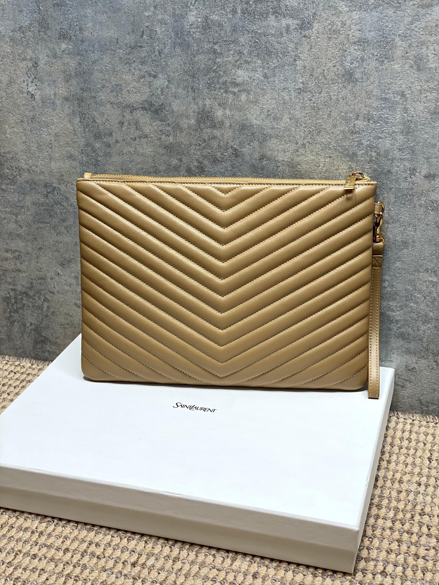 Tan quilted small crossbody bag with chevron stitching and gold top hardware