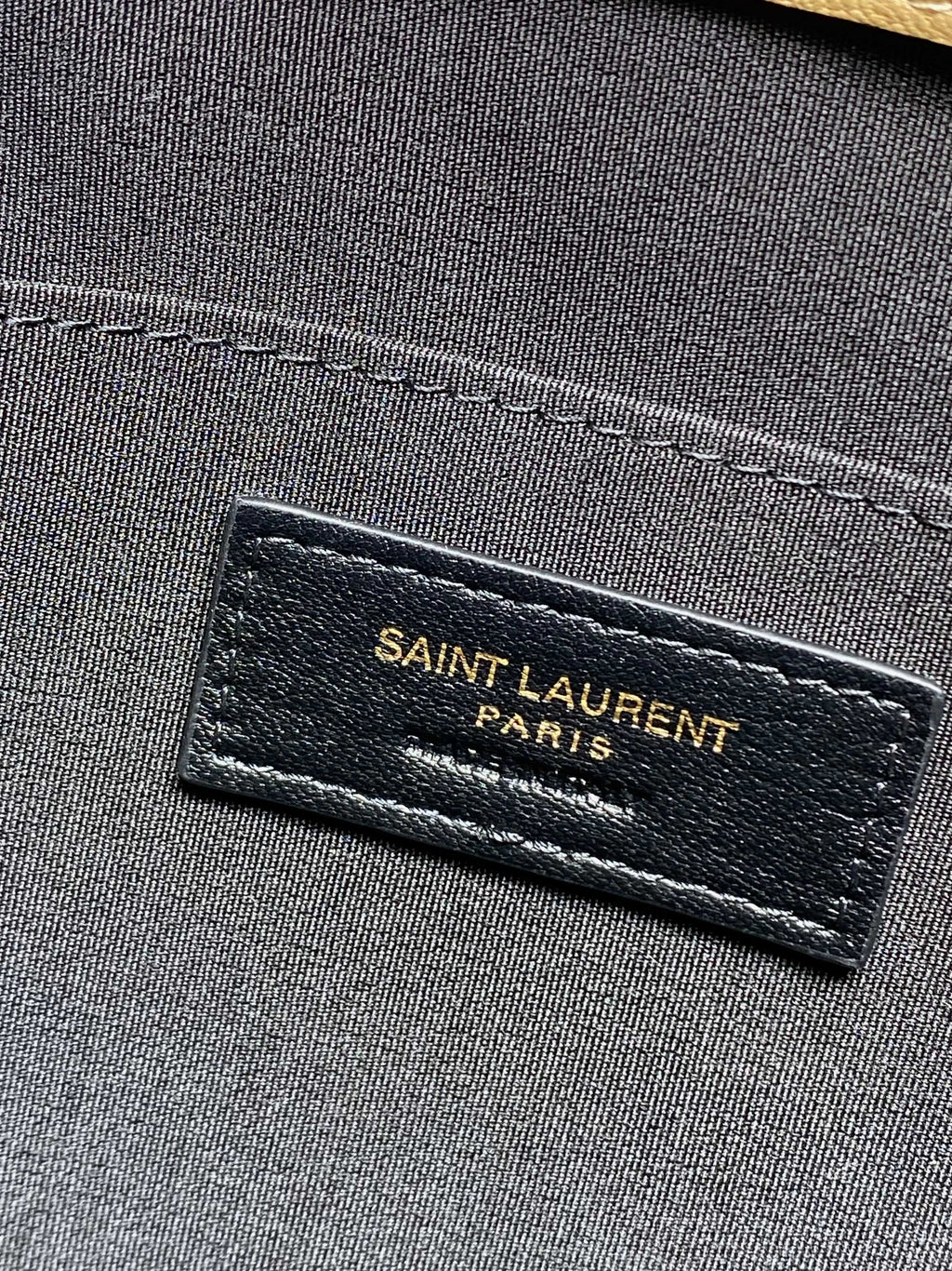 SAINT LAURENT PARIS label on inner panel of dark lined small bag