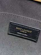 YSL Paris logo label on dark fabric lining inside tan bag