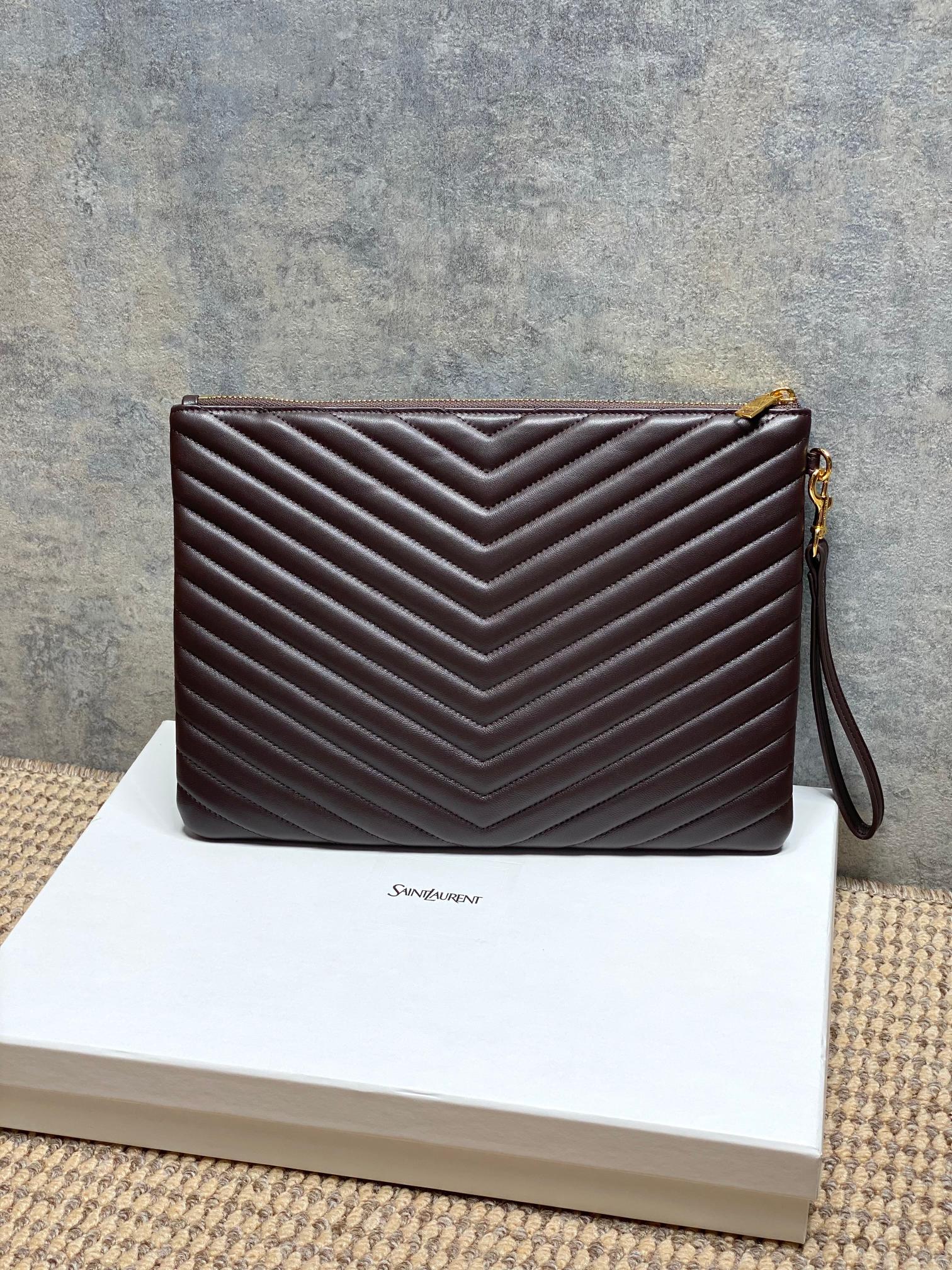 YSL small dark brown quilted handbag with chevron stitching and hanging wrist strap