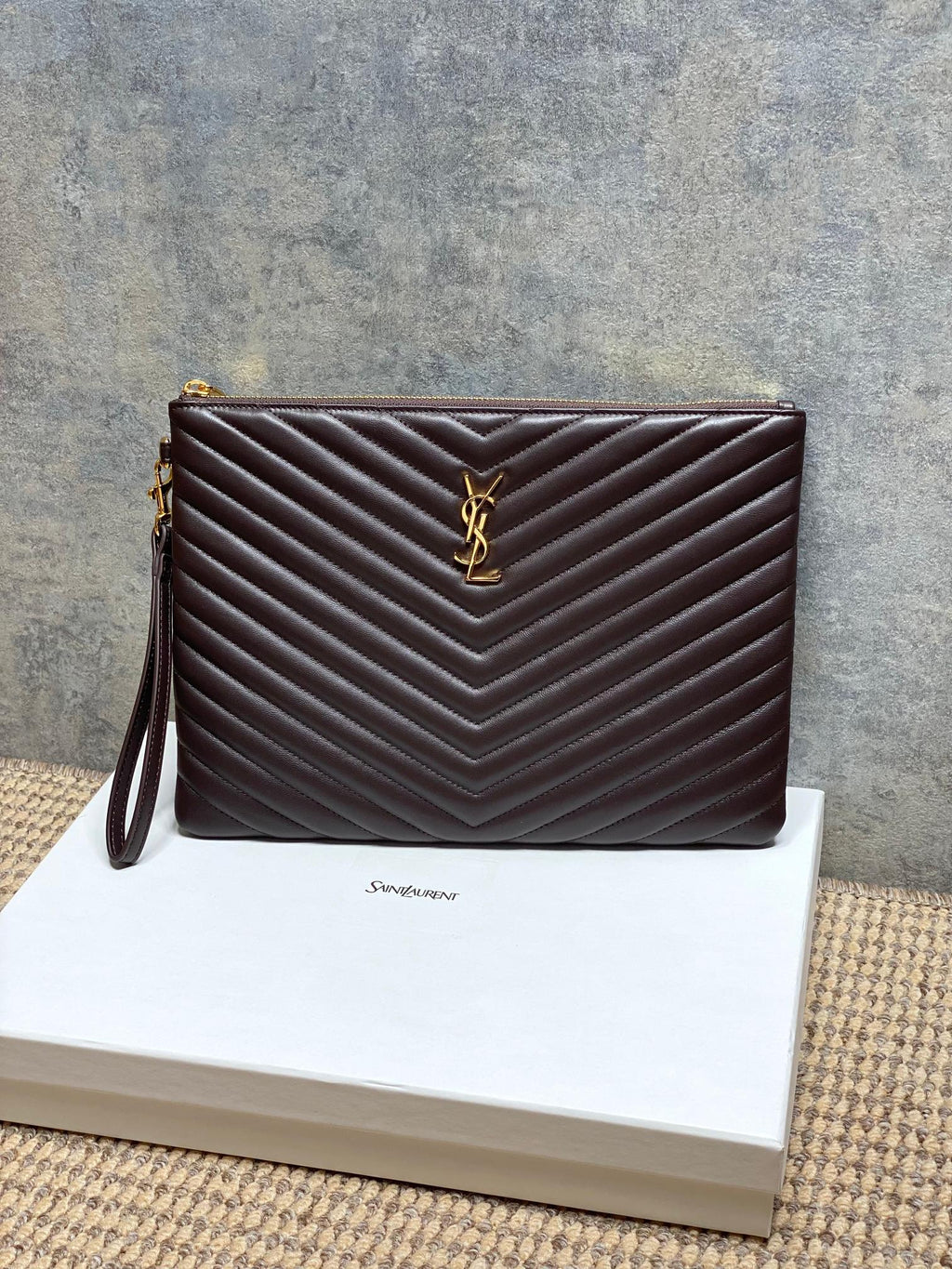 Quilted leather crossbody bag with chevron pattern and gold YSL logo