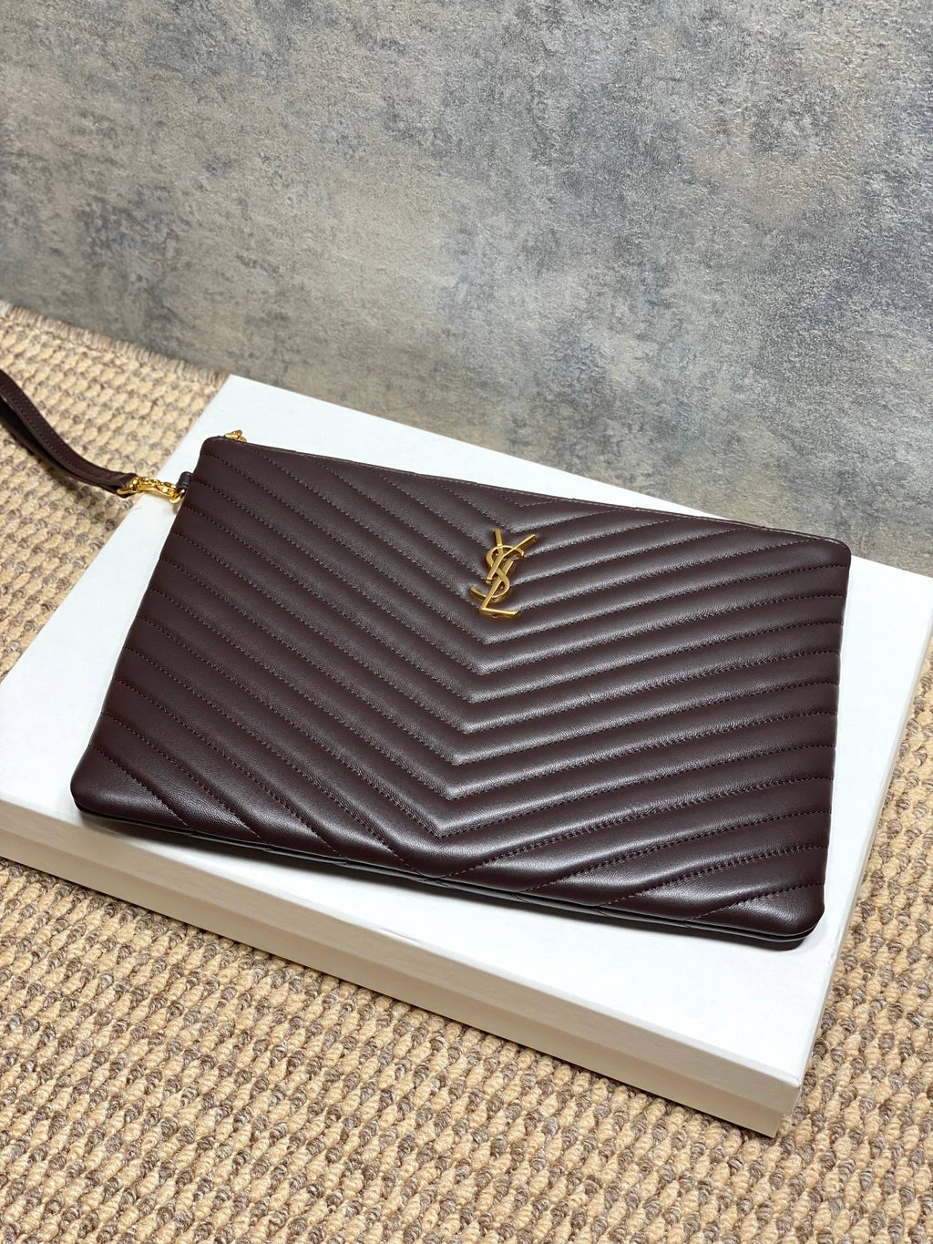YSL small dark brown chevron quilted handbag with YSL logo on front and top edge