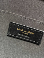 SAINT LAURENT PARIS logo label on dark fabric lining inside the YSL handbag