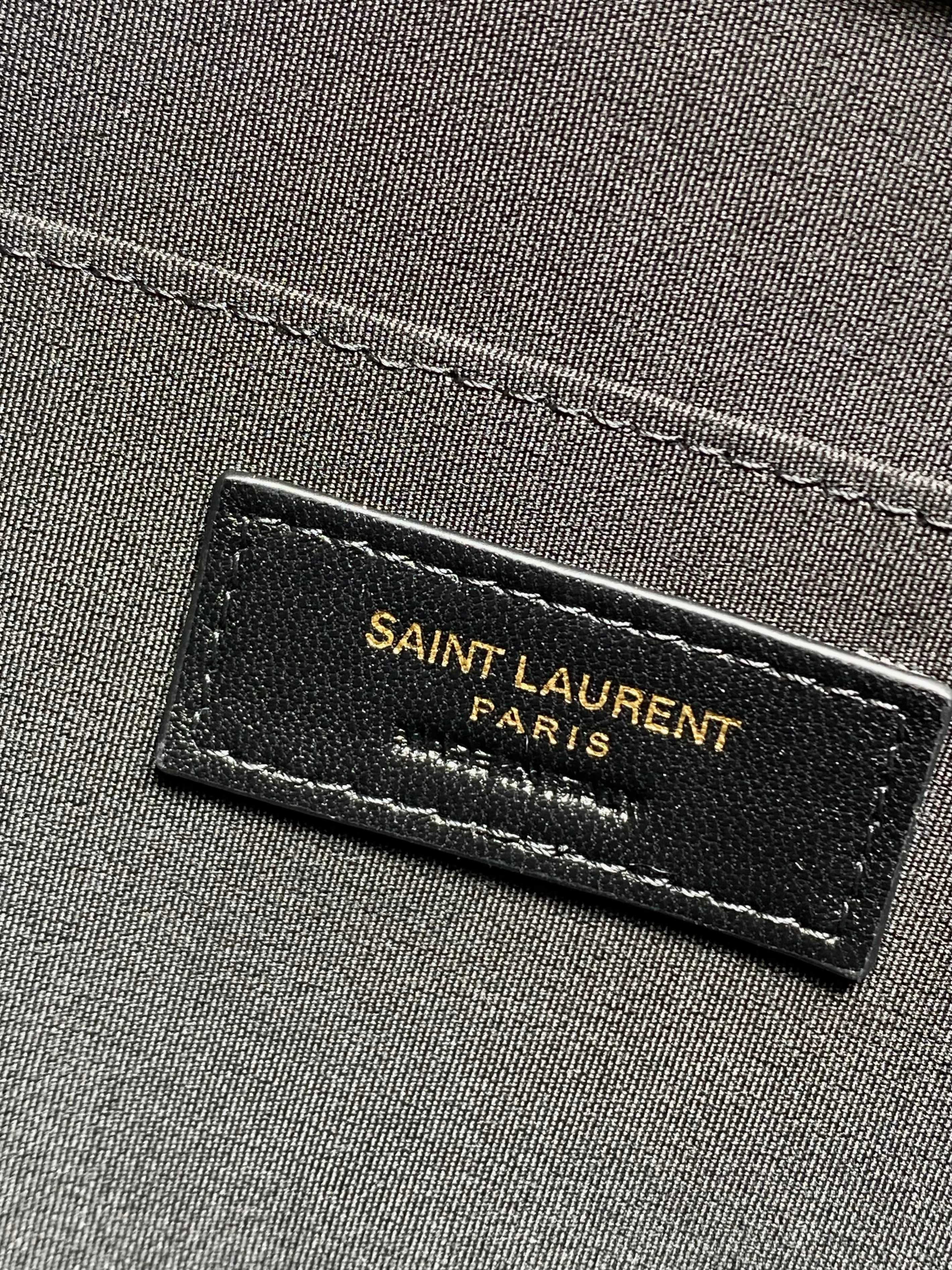 SAINT LAURENT PARIS logo label on dark fabric lining inside the YSL handbag