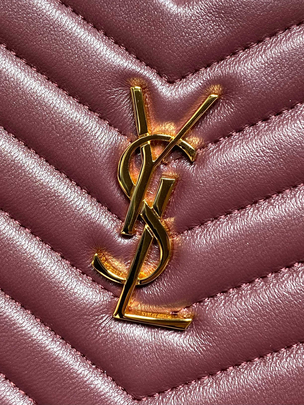 Burgundy leather chevron panel with gold-tone YSL logo emblem