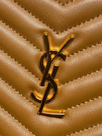 YSL gold logo hardware on tan quilted chevron leather bag