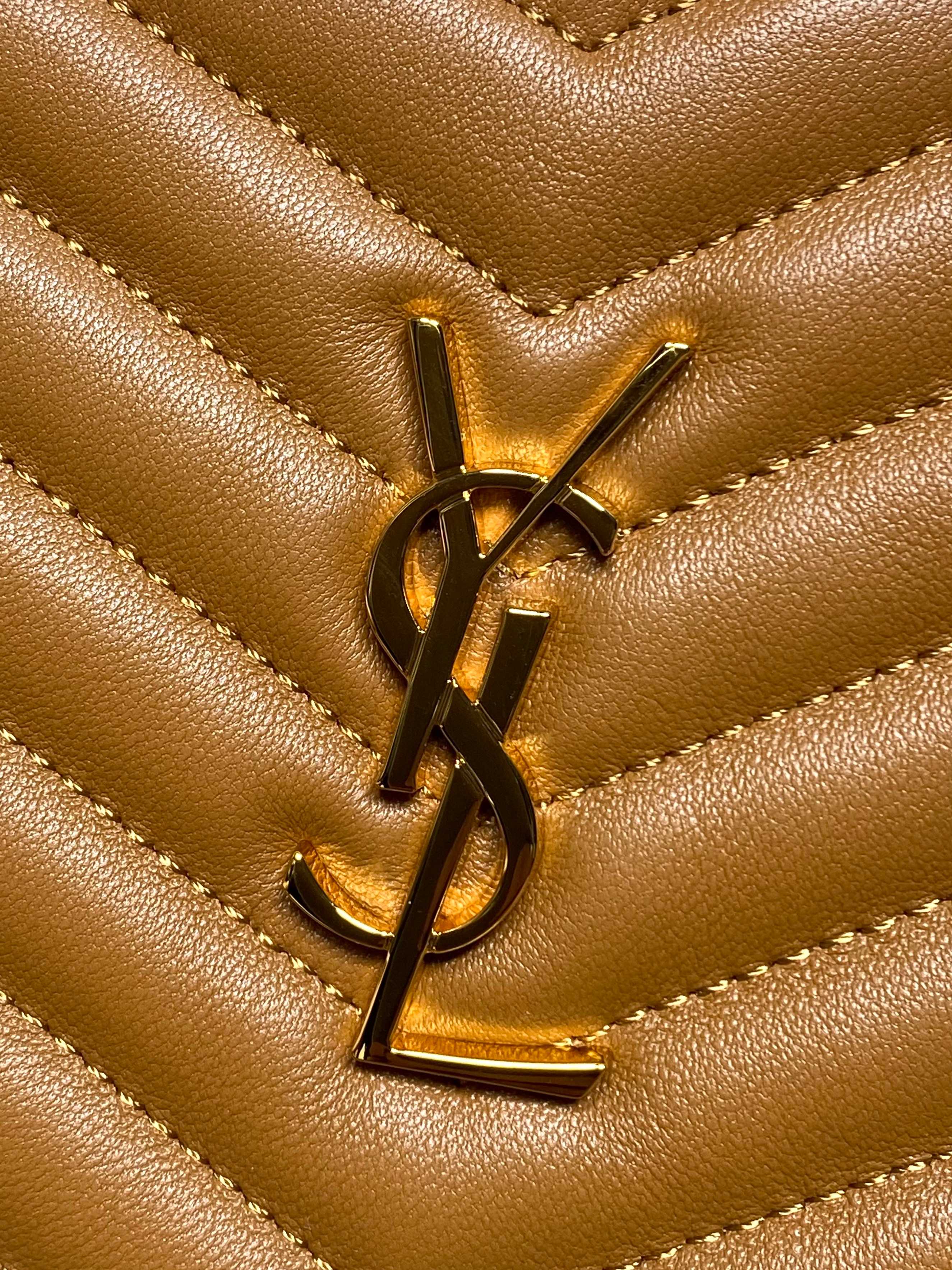 YSL gold logo hardware on tan quilted chevron leather bag