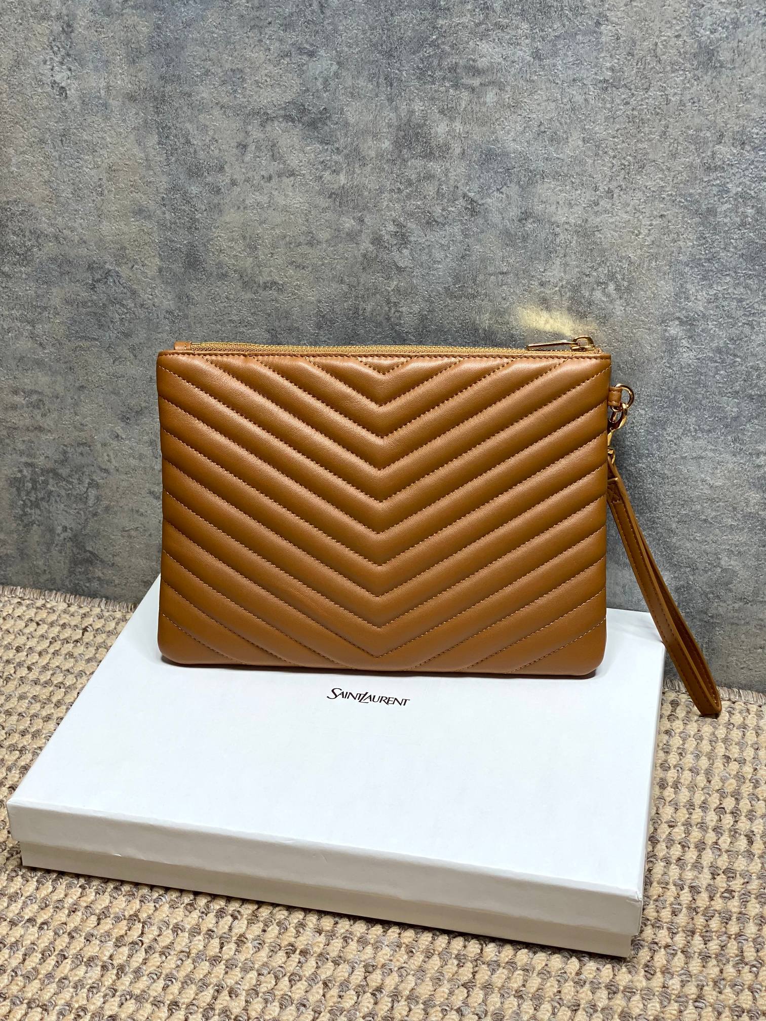 Small YSL quilted bag with chevron stitching, top zip, brown leather