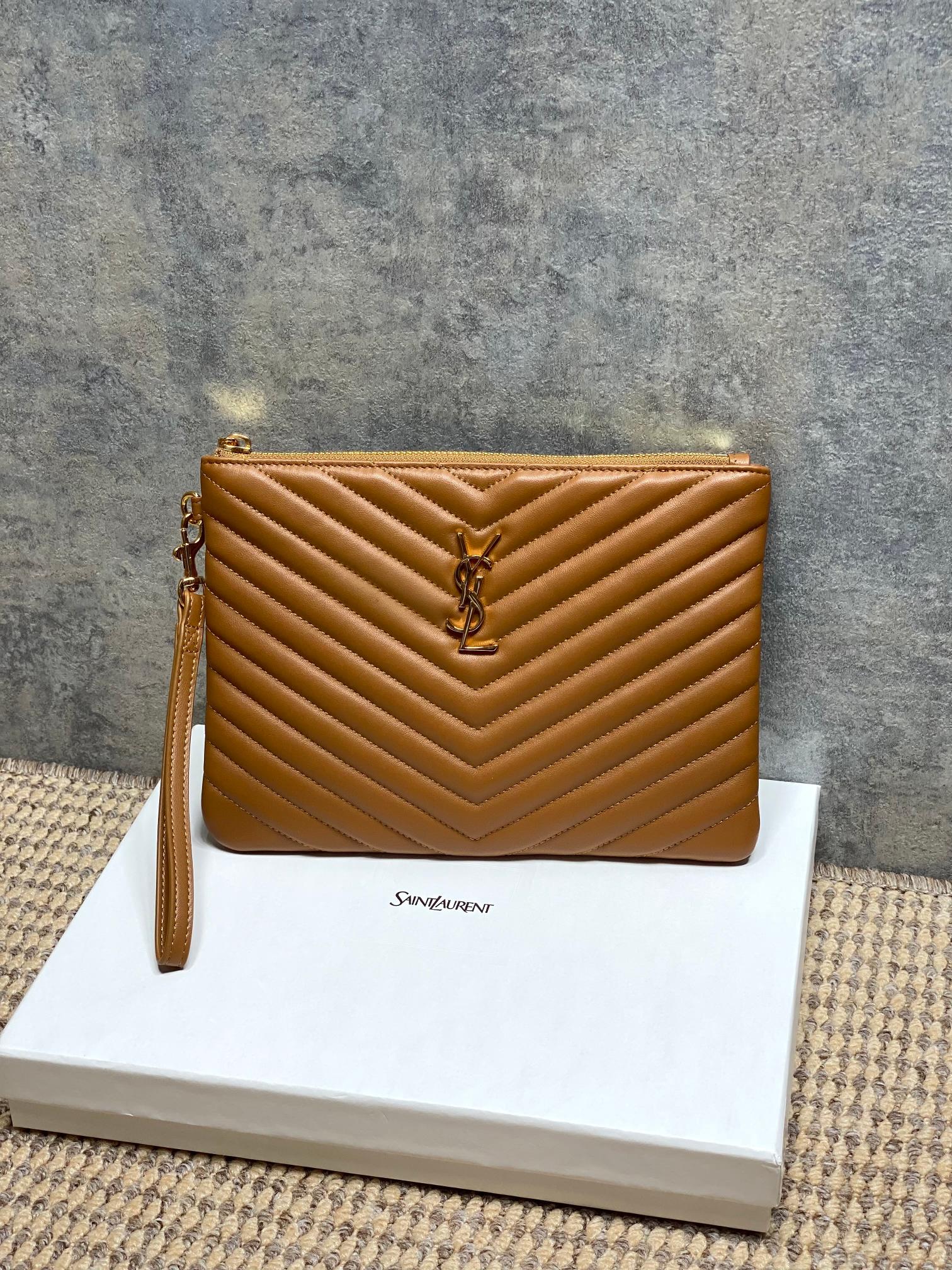 Chevron quilted leather clutch with YSL logo and top zipper, tan-brown.
