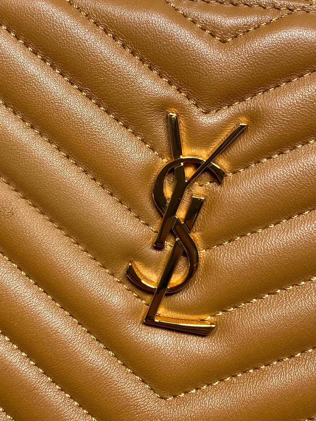 YSL gold metal logo on quilted chevron leather, brown