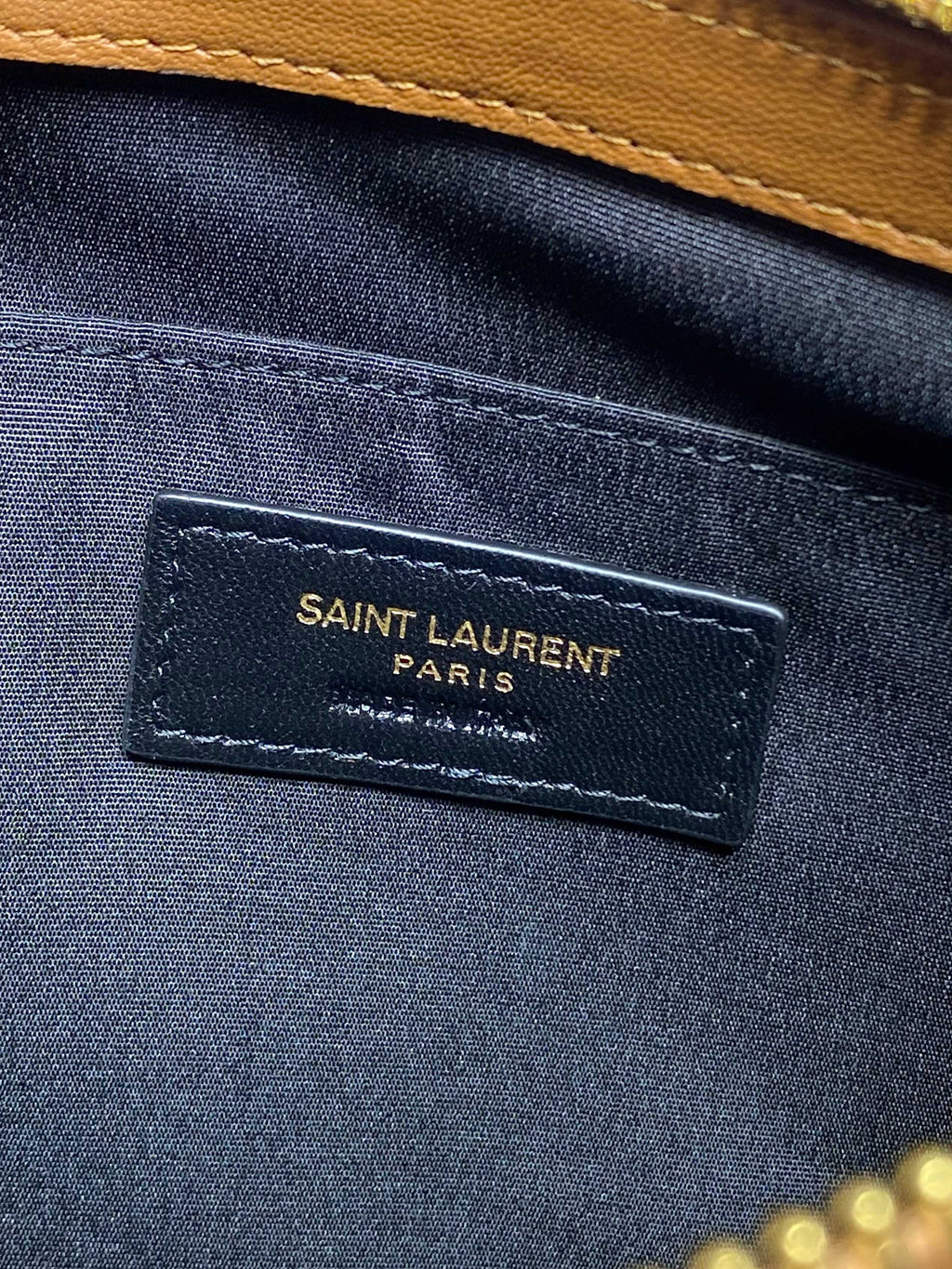 Navy interior label reading SAINT LAURENT PARIS on small bag