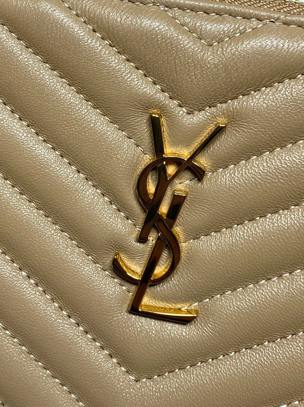 YSL quilted bag detail in tan chevron leather with gold YSL logo emblem