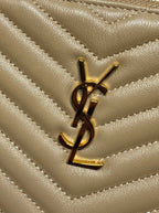YSL gold-tone monogram logo on light tan quilted leather with chevron stitching