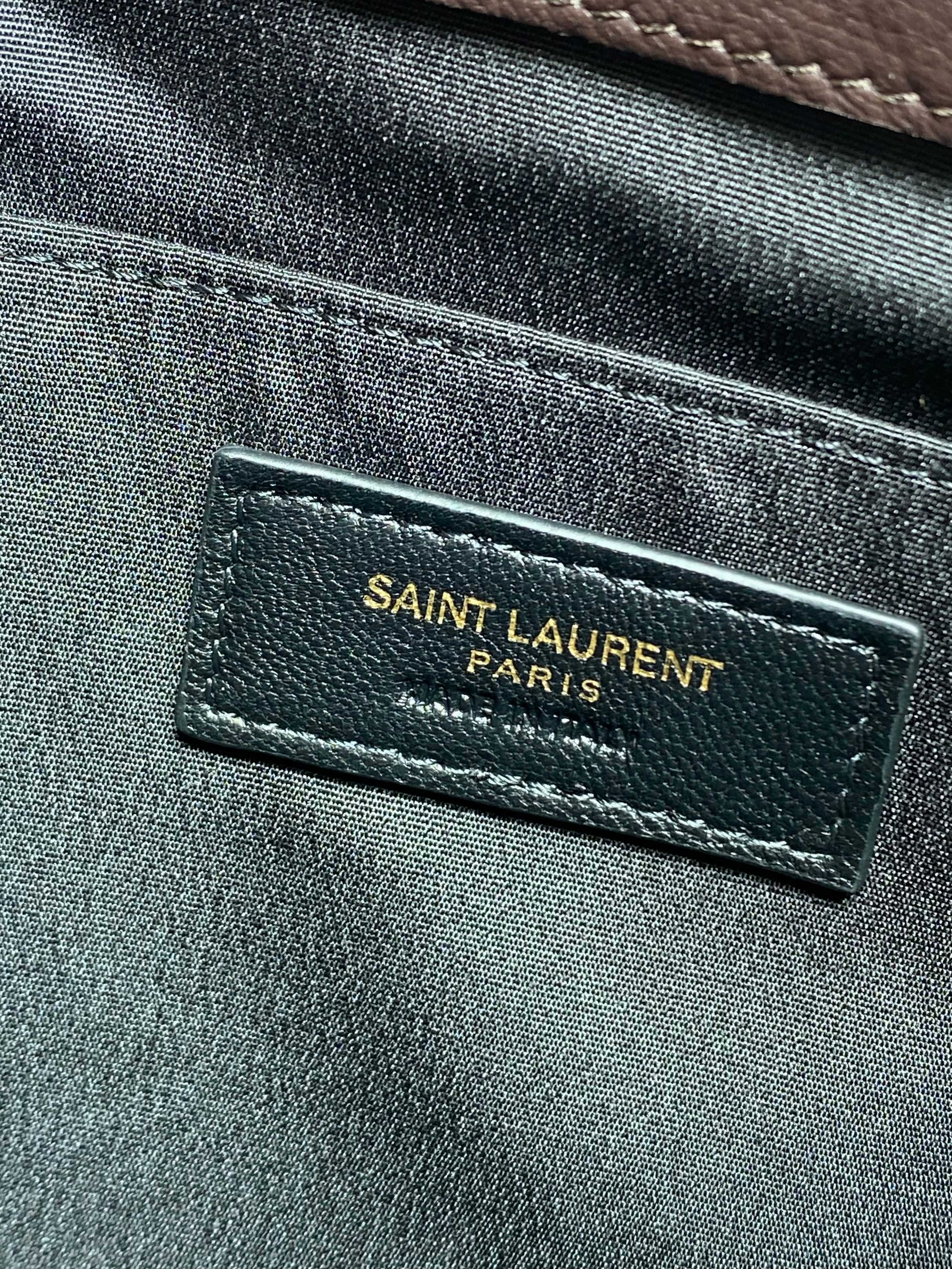 SAINT LAURENT Paris label on dark brown textured leather bag