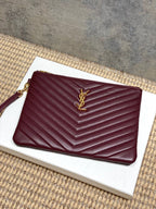 Burgundy quilted zip clutch bag with gold-tone YSL-style logo on front