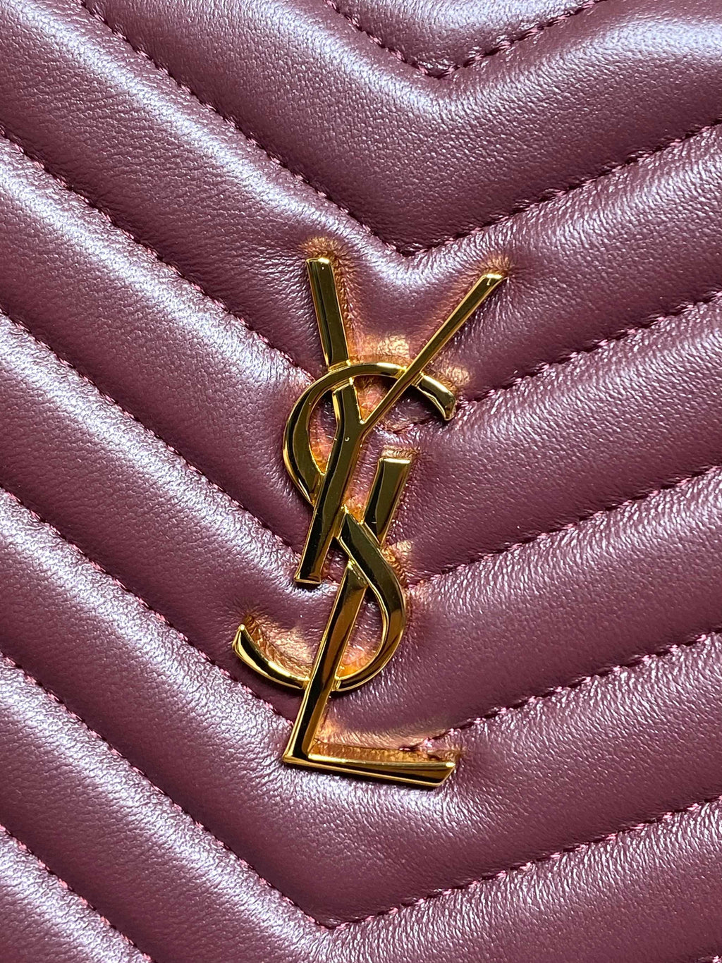 Gold YSL monogram on burgundy quilted chevron leather