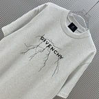 Light gray Givenchy T-shirt close-up with tree-branch graphic and logo