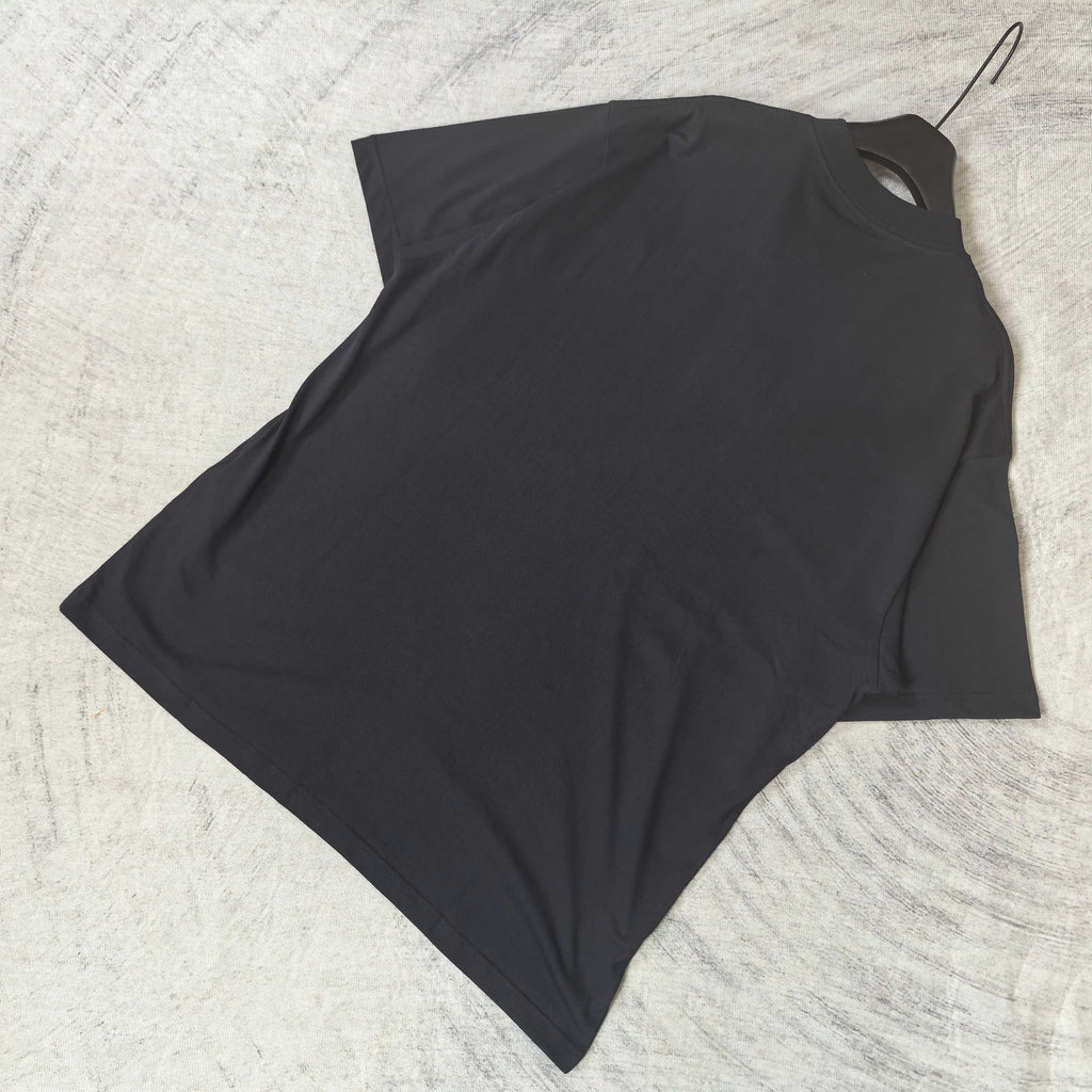 Balenciaga short-sleeve T-shirt, dark; angled flat-lay view without front graphic