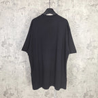 Balenciaga short-sleeve T-shirt, dark; plain back view on hanging display