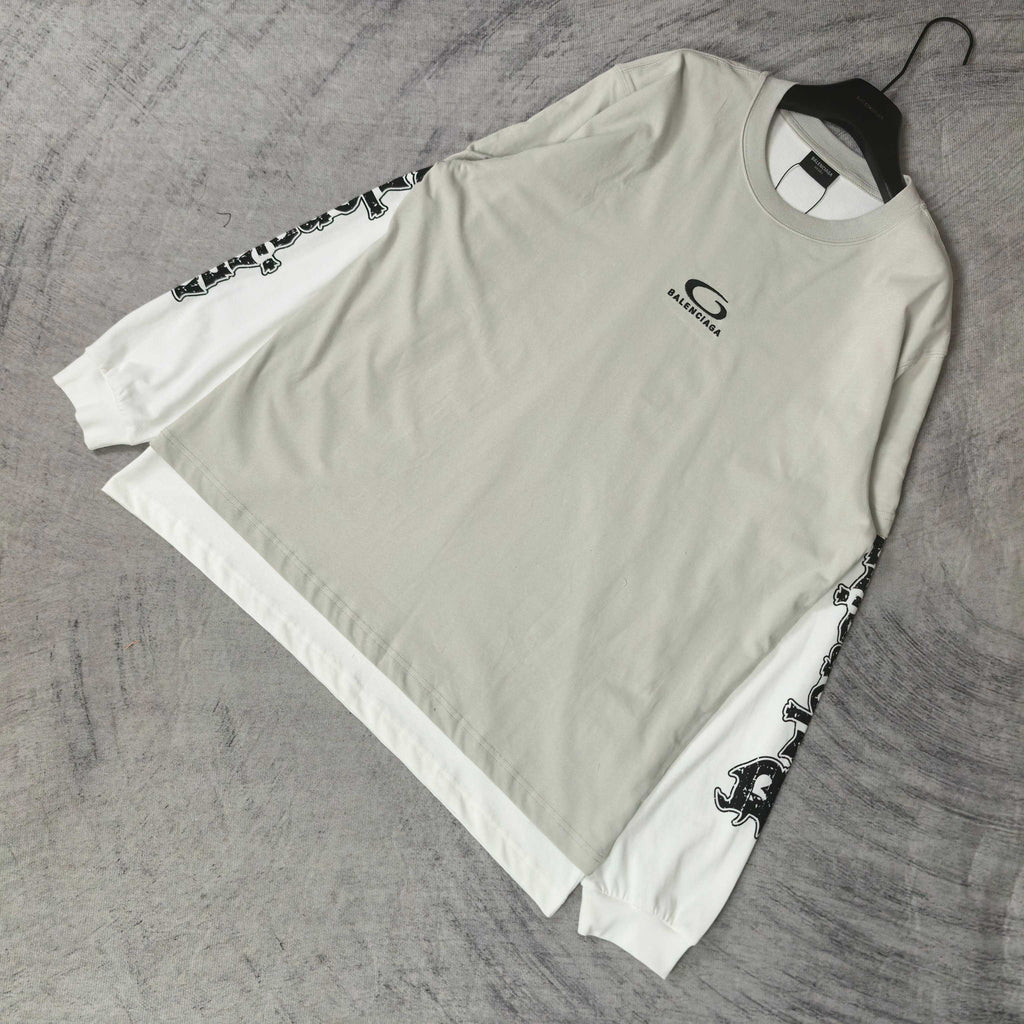 Off-white long T-shirt with crew neck and black graphic branding along sleeves