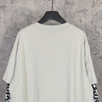 Off-white long T-shirt, crew neck, plain back with graphic sleeve text