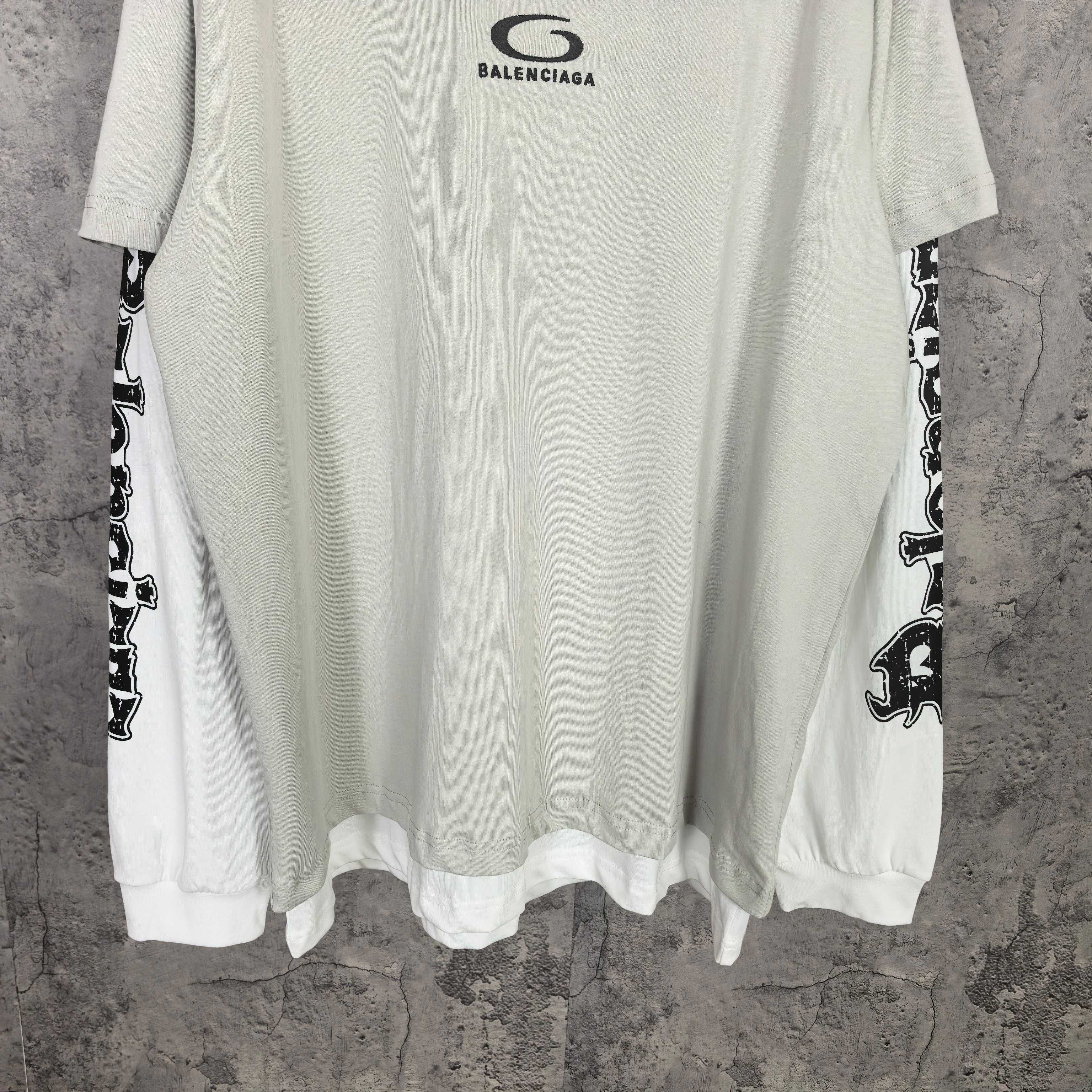 Off-white long T-shirt hem with cuffed sleeves and black graphic sleeve print