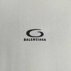 Chest logo on off-white long T-shirt reading BALENCIAGA
